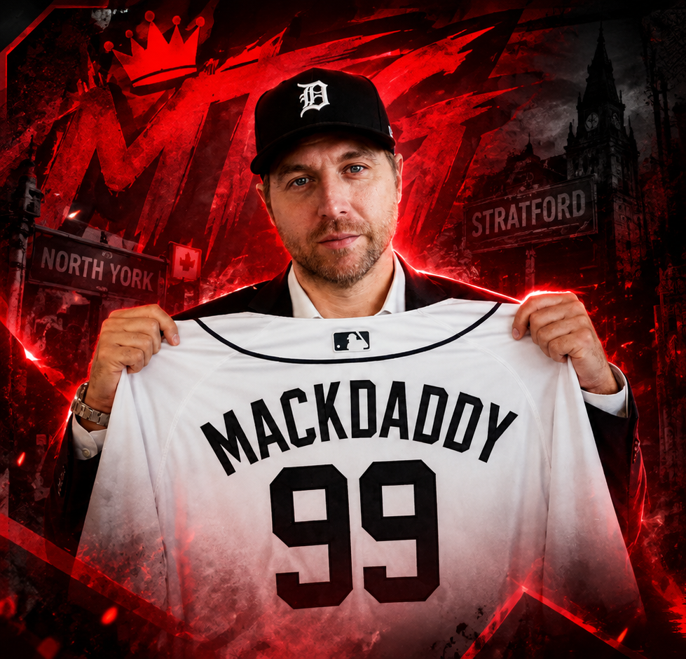 Ryan Mackenzie holding a Mackdaddy 99 baseball jersey